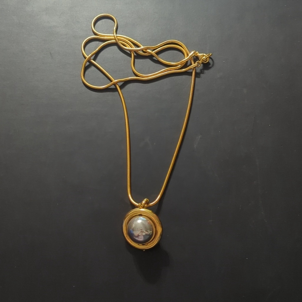 Liz Claiborne Gold and Silver Tone Long Spinning Orb Pendant Statement Necklace